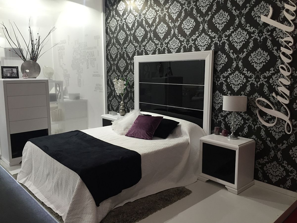 Dark and mirrored finishes add glam to the black and white bedroom inspiration