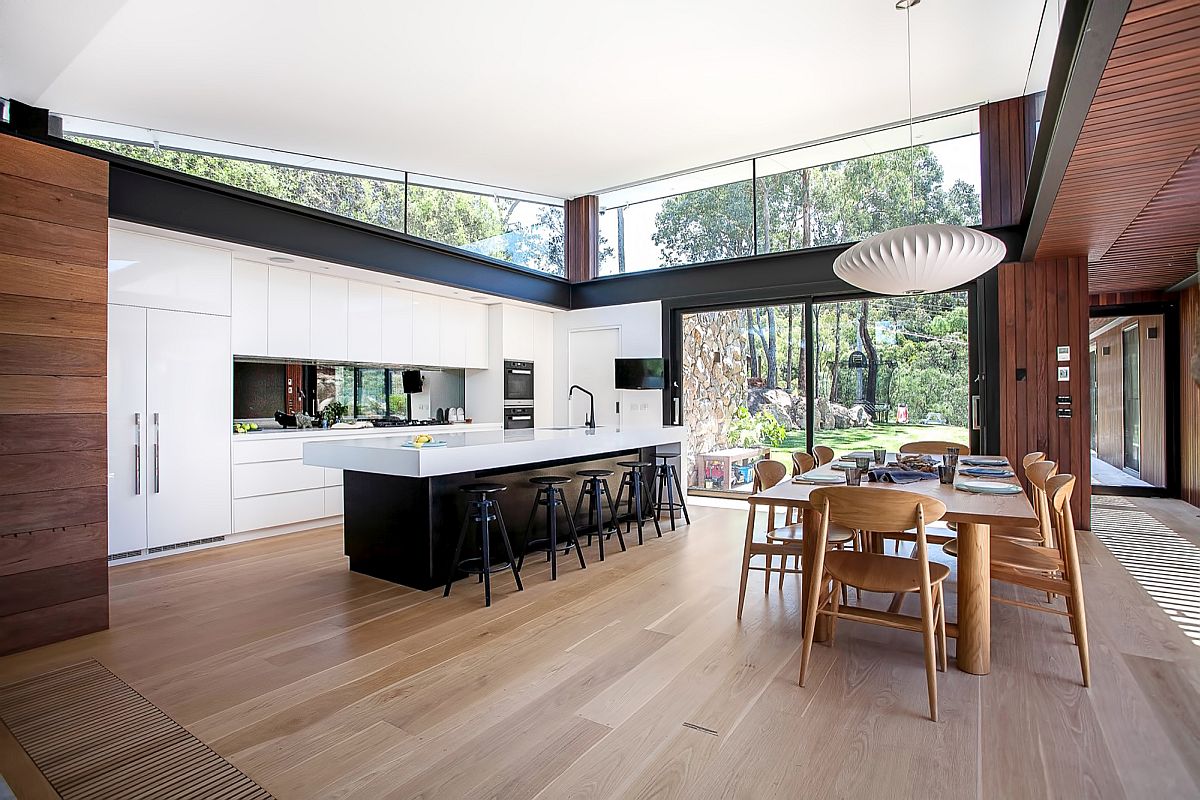 Dark kitchen island with a white countertop is a showstopper