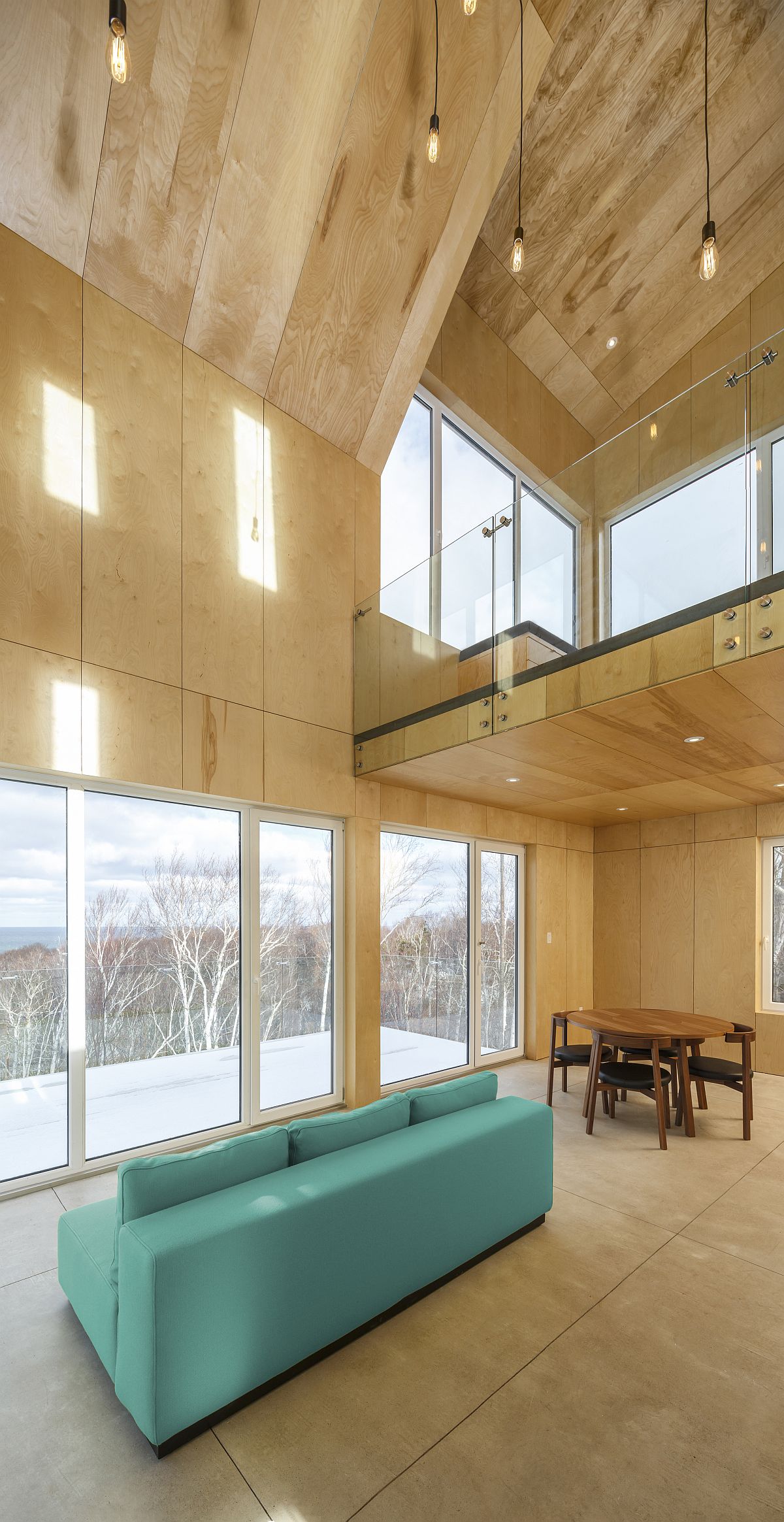 Double height kitchen and dining space of the cabin on the ground level