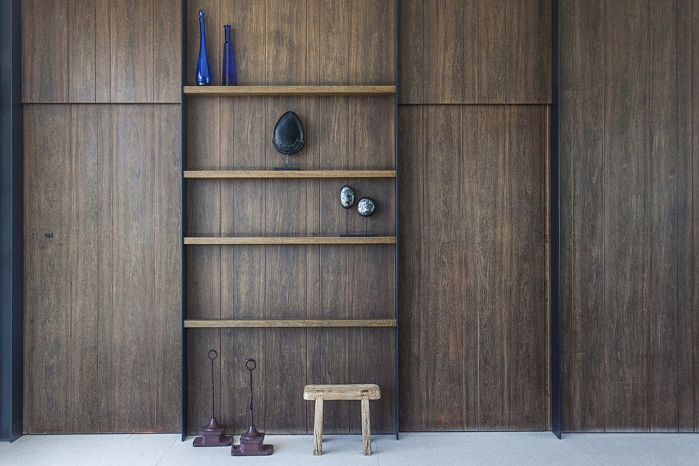 Dyed walnut and sanded lapacho shelves inside the home