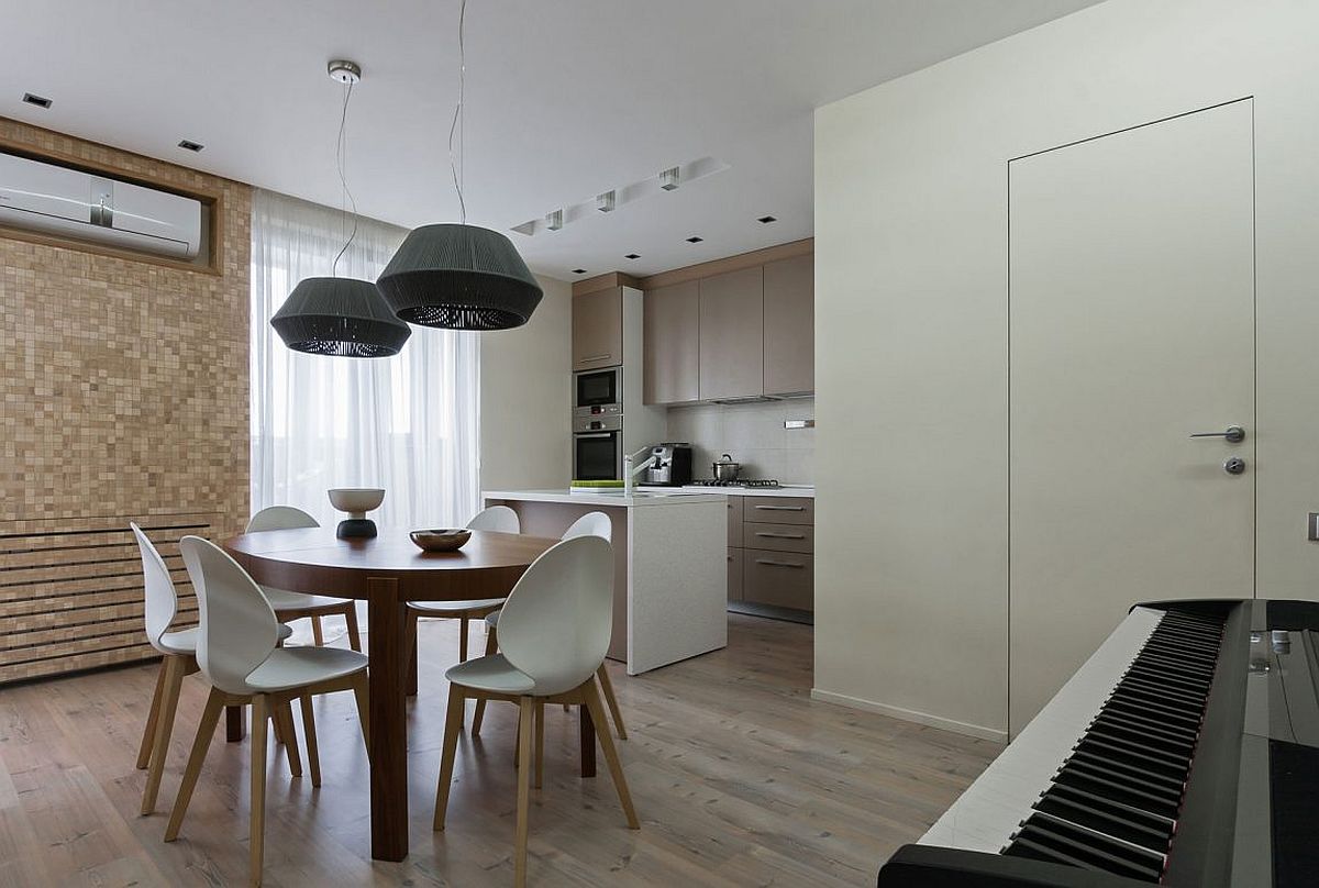 Elegant and space-savvy dining space and kitchen of modern apartment