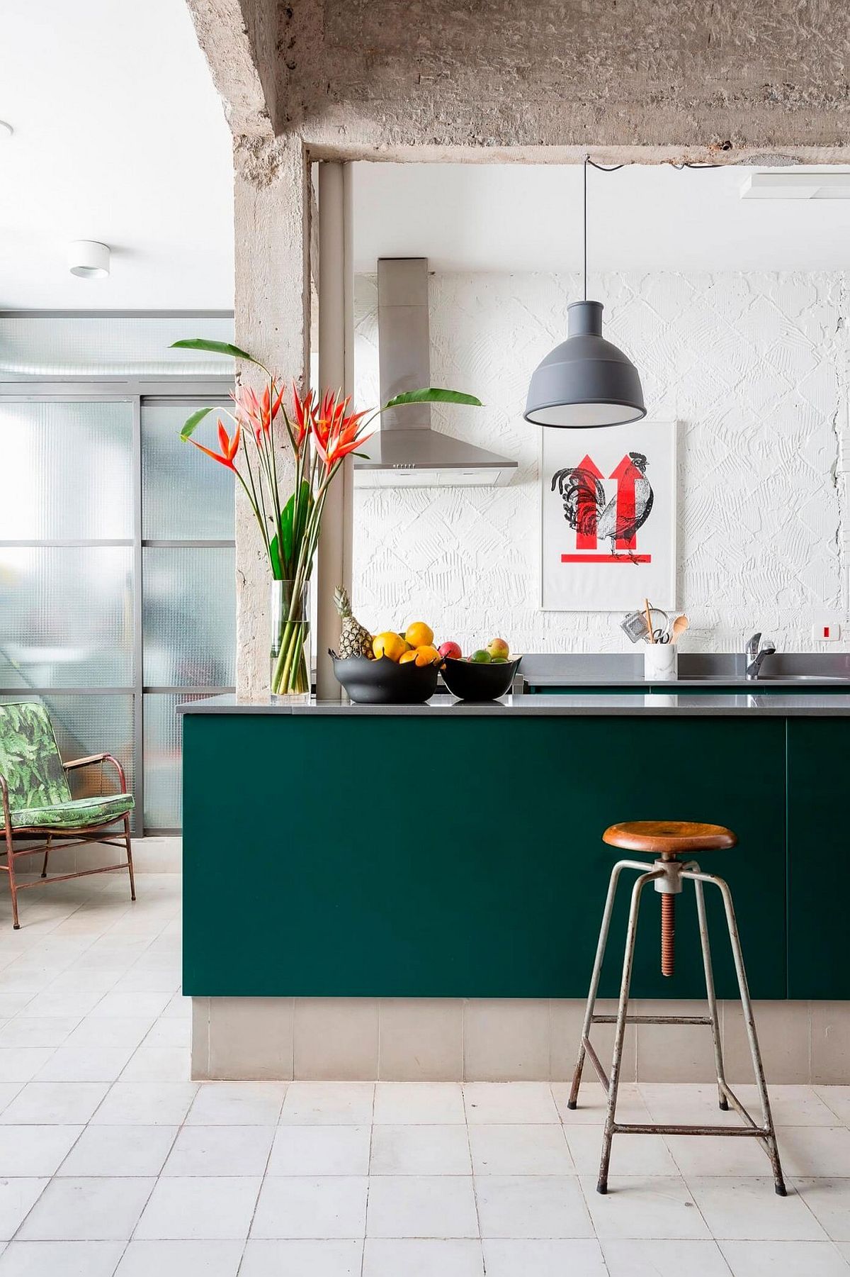 Exposed cement beams, textured kitchen backsplash and a colorful kitchen island for the Sao Paulo home