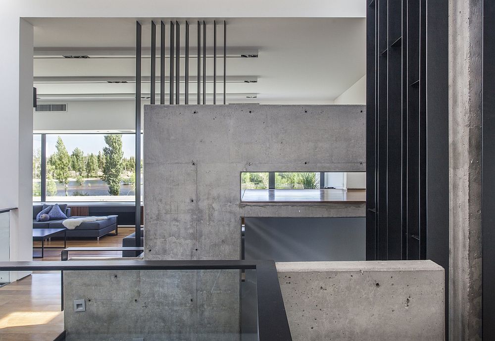 Exposed concrete walls add a fun element to the interior