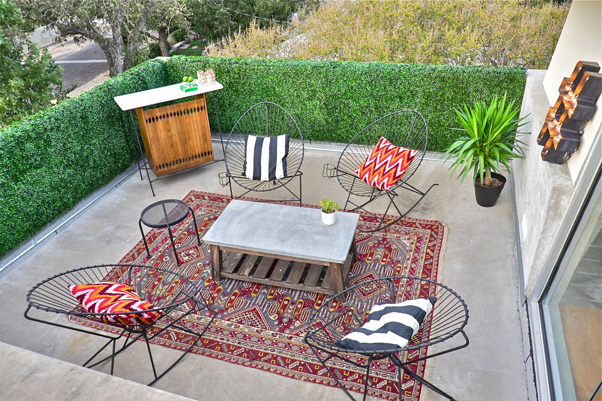 Faux boxwood on a balcony