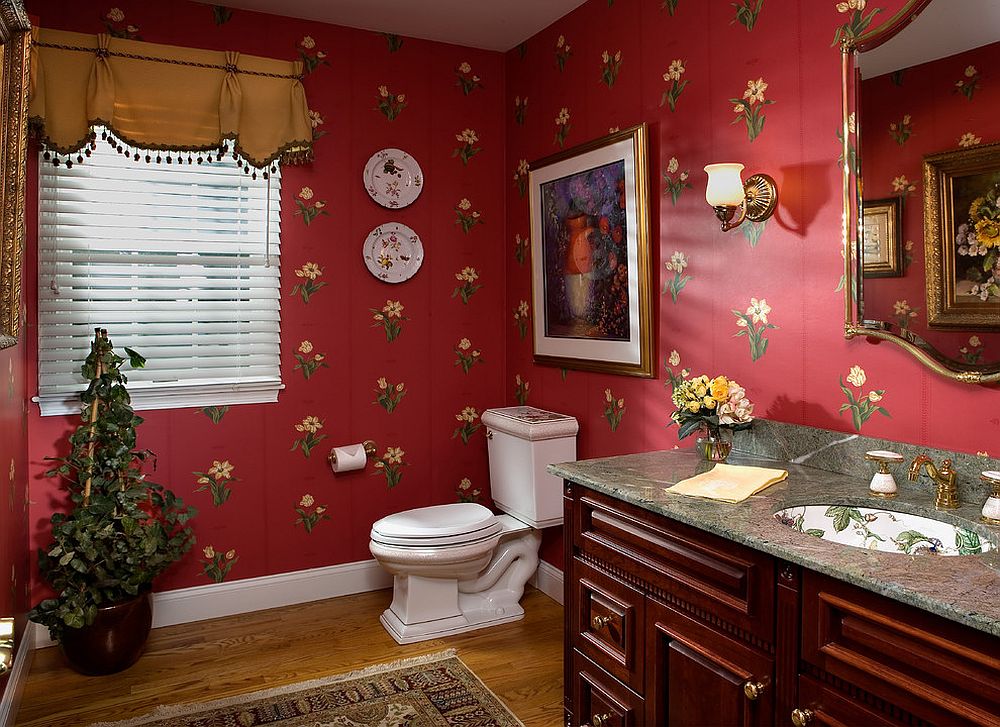 Flowery wallpaper with lots of red is perfect for the classic and playful Victorian powder room [Design: Diane Burgoyne Interiors / Photography by Tim Proctor]