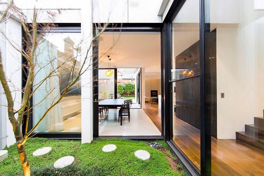 Glazed walkway and glass extension give the classic home a modern vibe