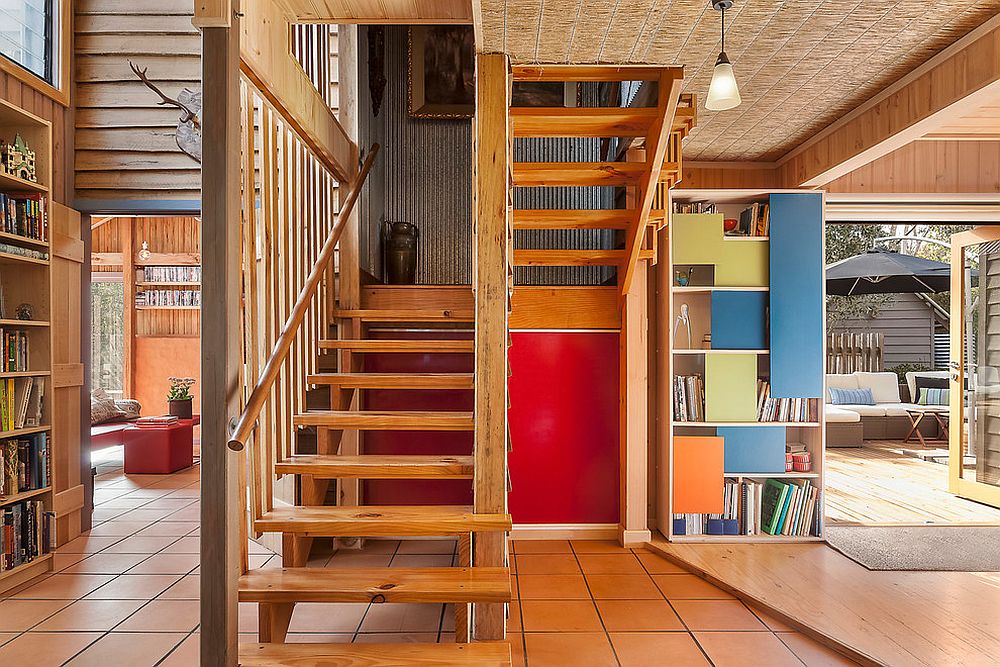 Ingenious bookshelf design with colorful sliding panels