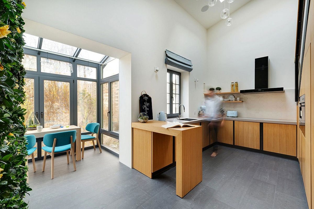 Kitchen and dining area of the playful apartment in Ukraine with ample natural light