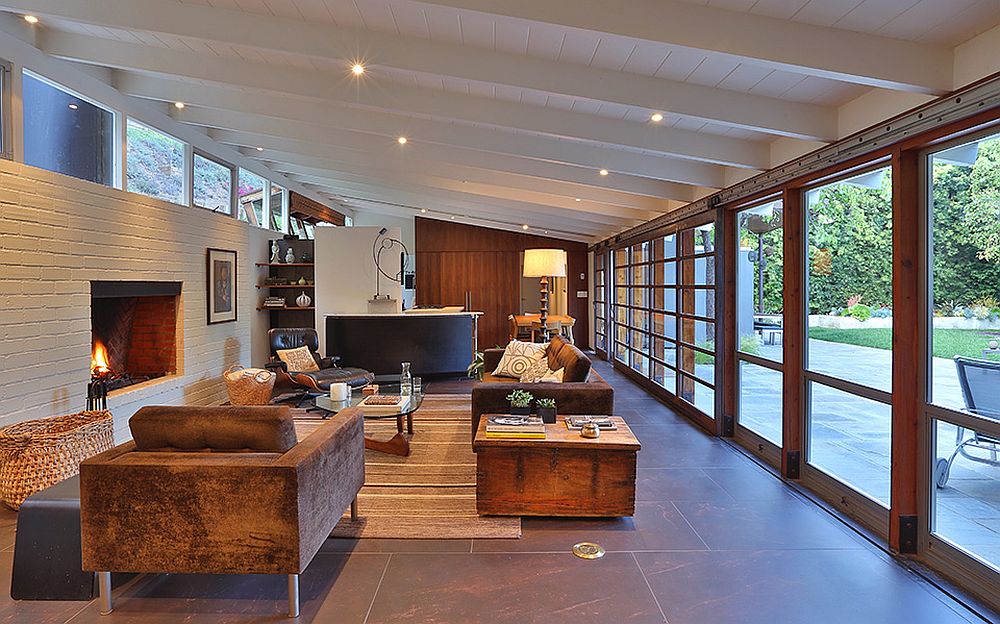 Large glass windows connect the living area with the outdoors