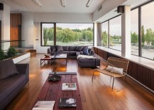 Large-windows-in-the-living-room-offer-a-view-of-the-river-outside-217x155