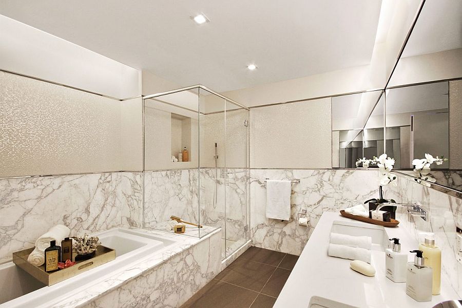 Luxurious master bathroom of opulent NYC apartment clad in marble