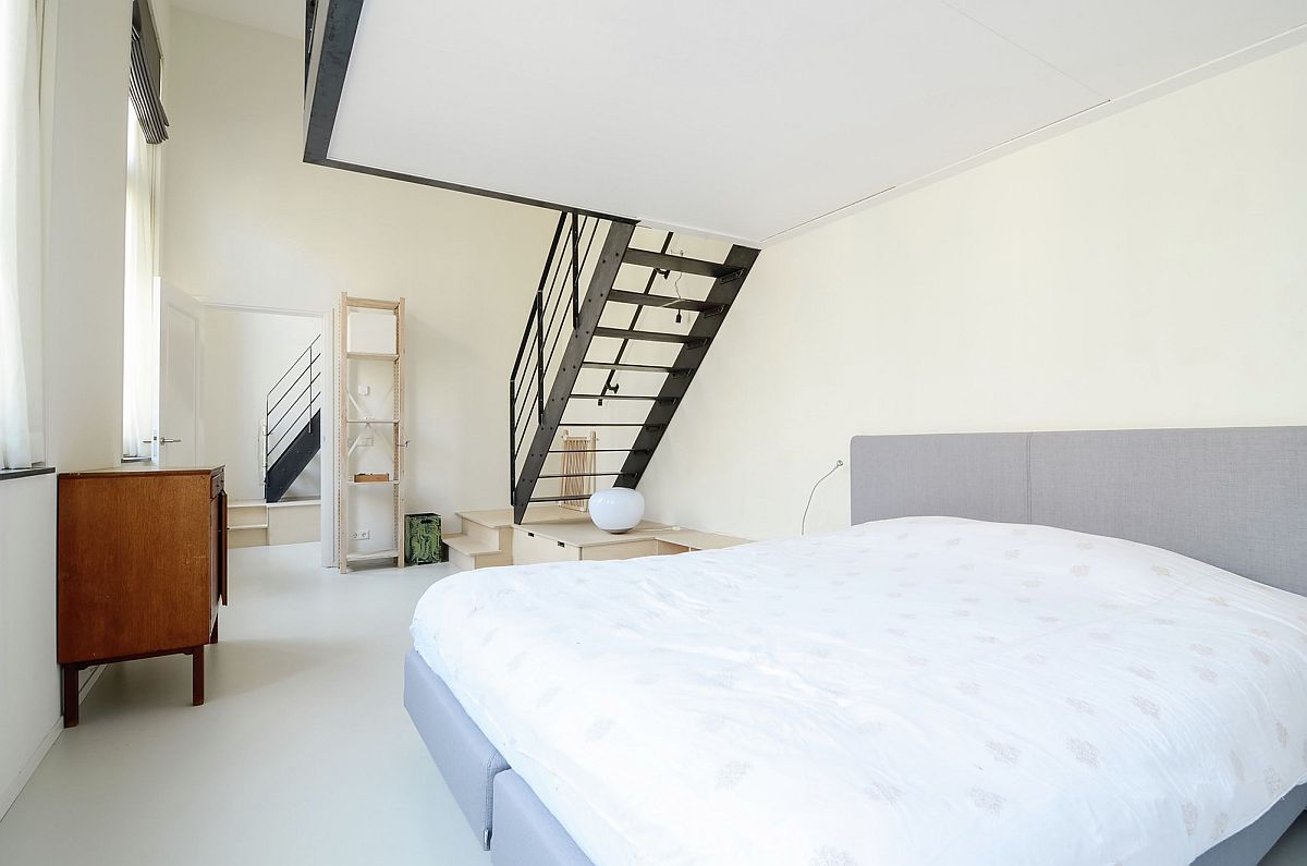 Master bedroom with ample light and mezzanine level