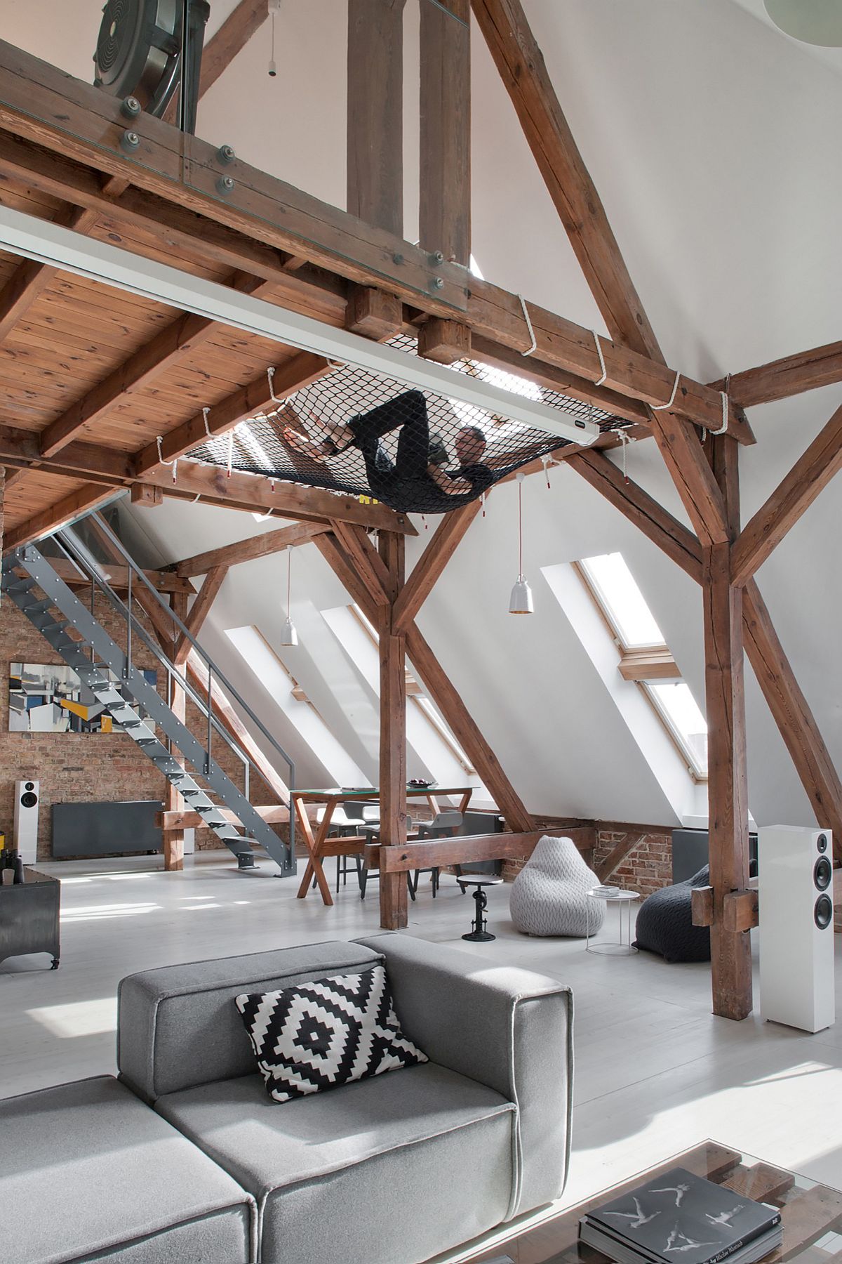Mezzanine level of the attic apartment with relaxing hammock