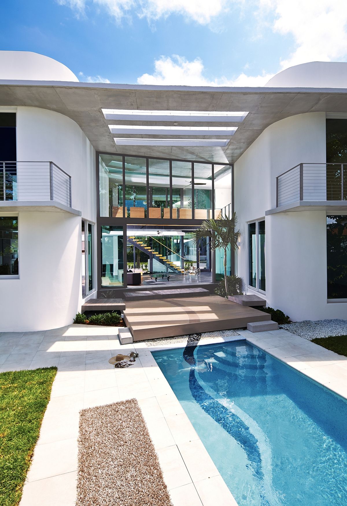 Miami's unique culture, MIMO style and heritage shape the contemporary residence with expansive backyard