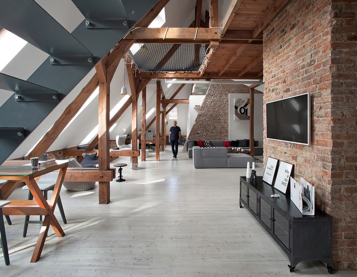 Modern attic apartment in Poznan by Cuns Studio