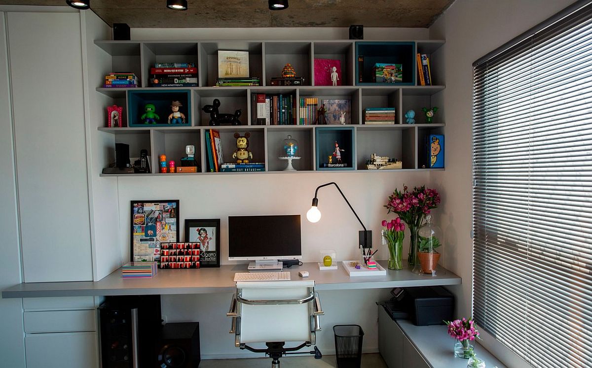 Modern home office with open bookshelf above workstation