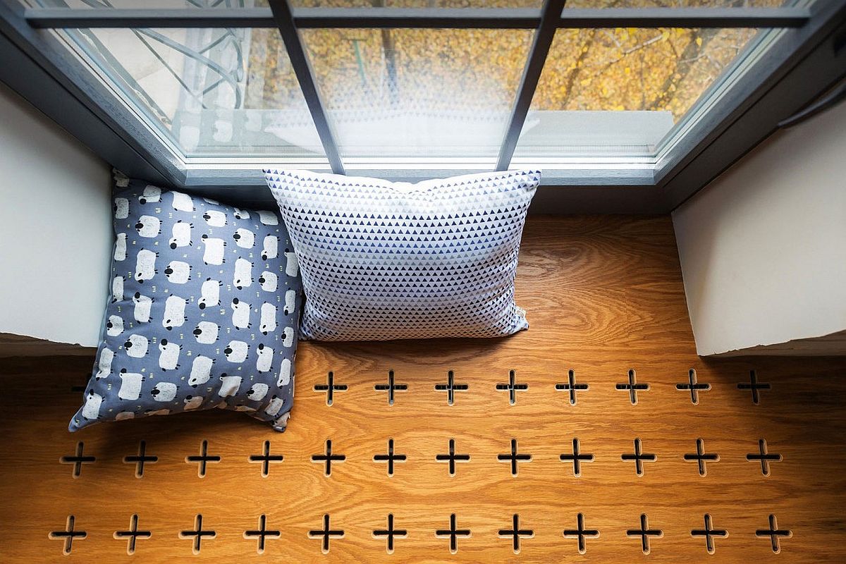 Oak planks with cross-shaped cut-outs for the window seat