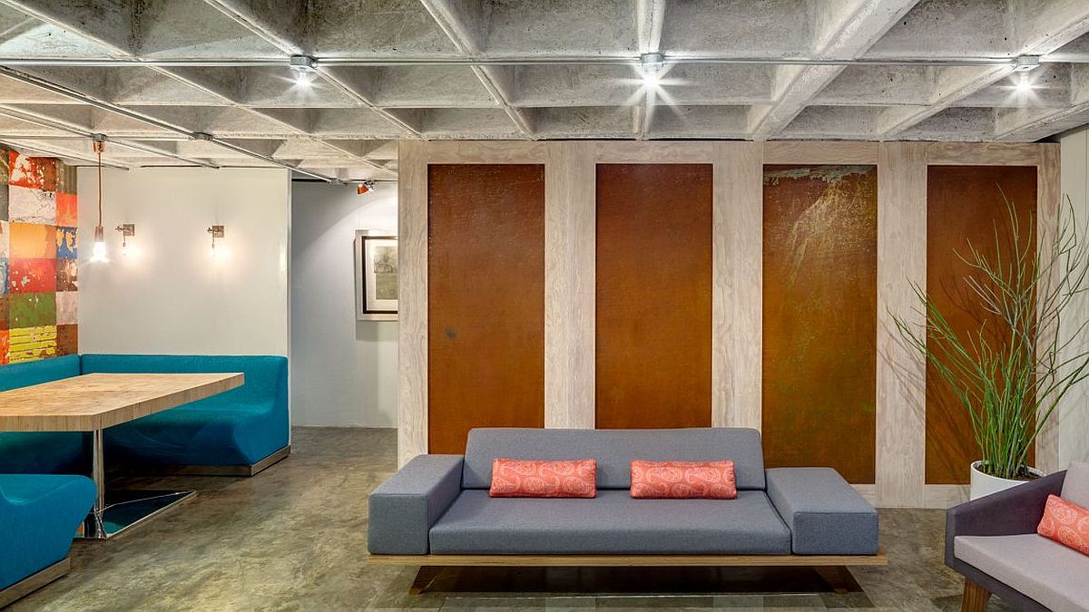 Old wooden boards reclaimed and revamped to dress up the columns inside the apartment