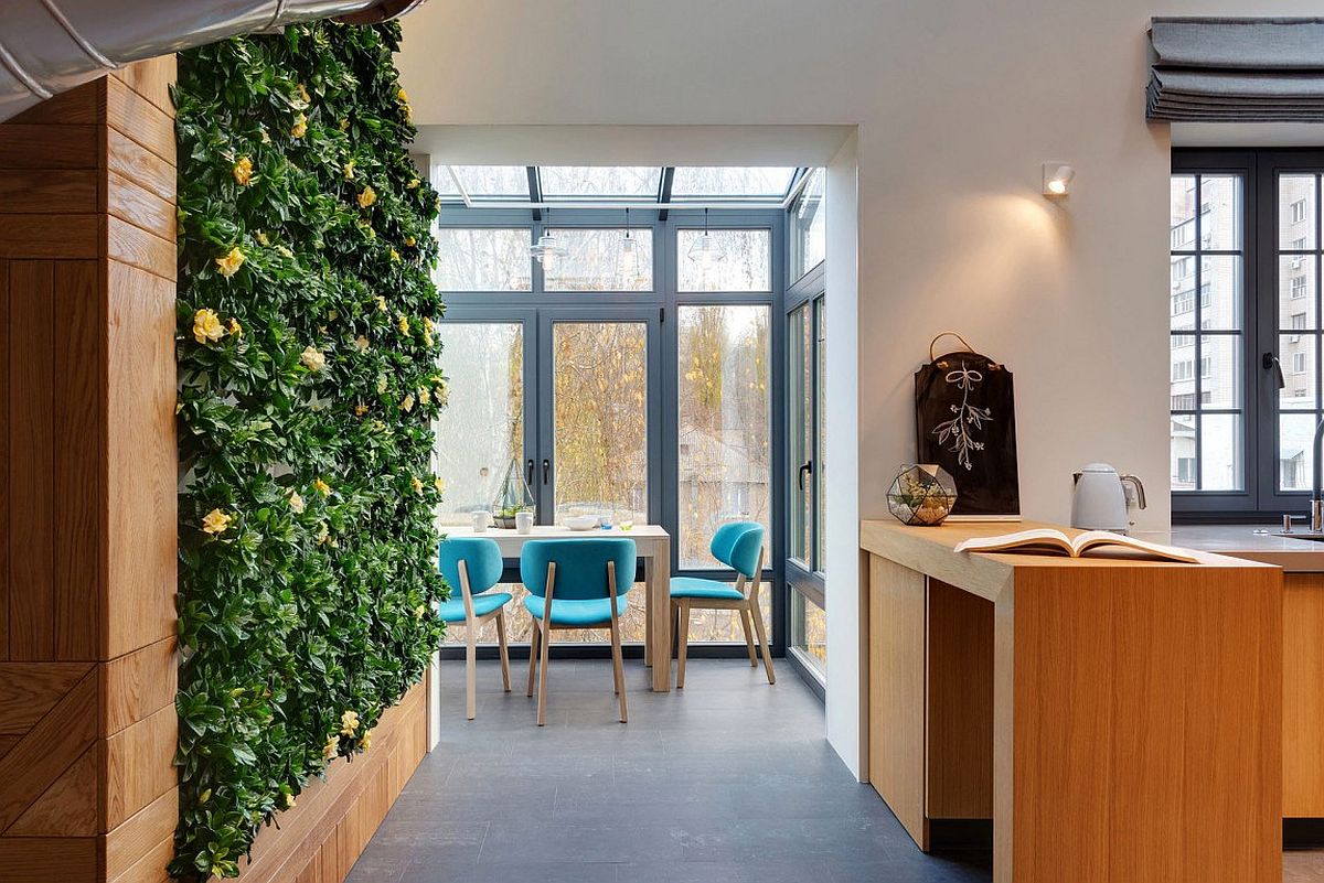 Plant-covered green wall next to the slide makes the interior even more unique