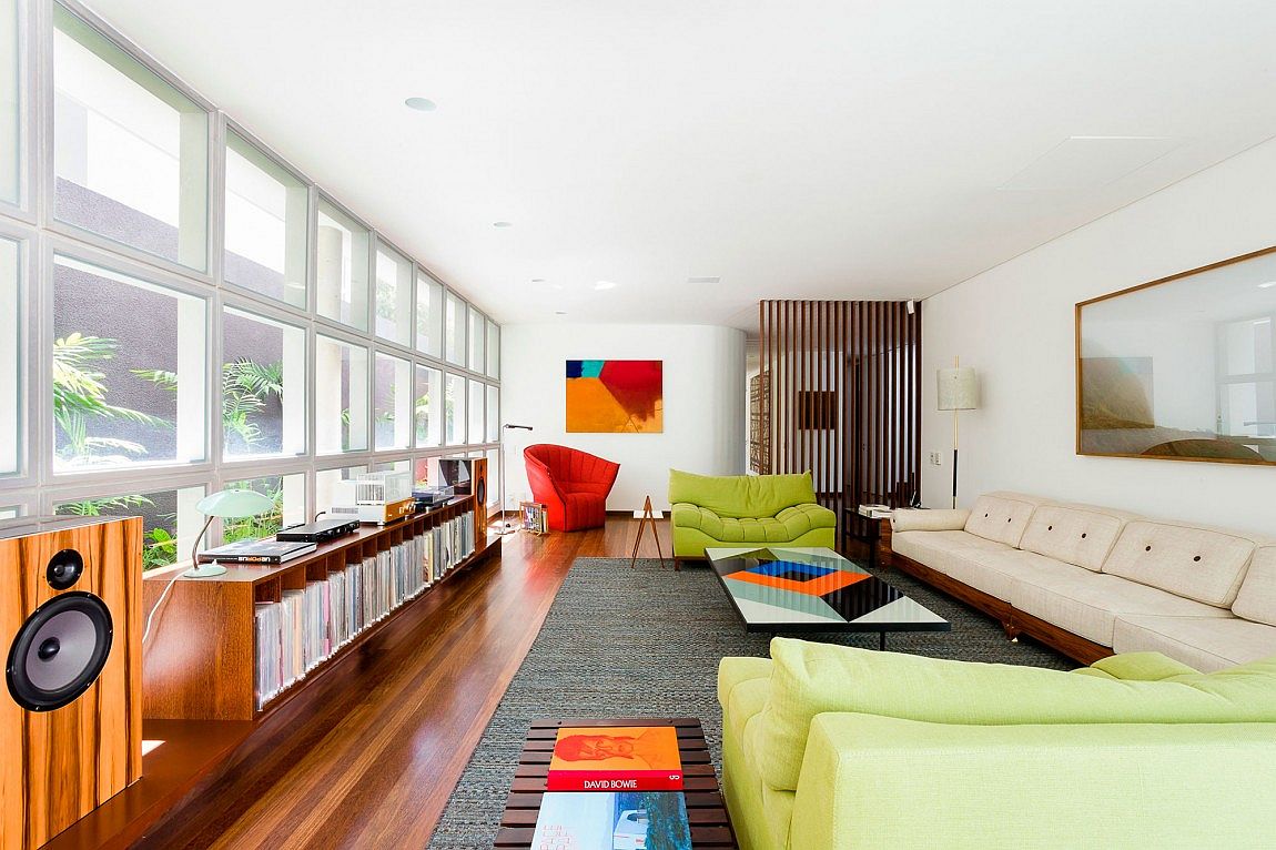 Pops of red, blue and green enliven the living space with glass panes