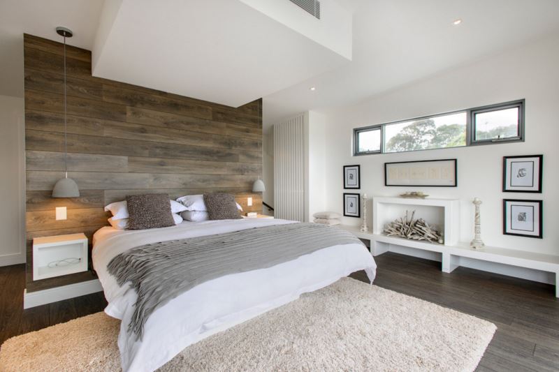 Relaxing bedroom with an accent wall of recycled wood