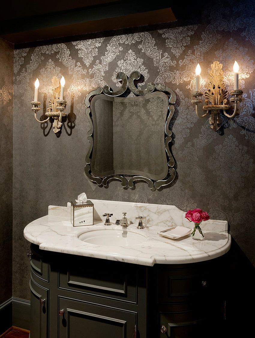 Sconce lighting and wallpaper bring Victorian style to this powder room [Design: Buster & Cogdell Builders]