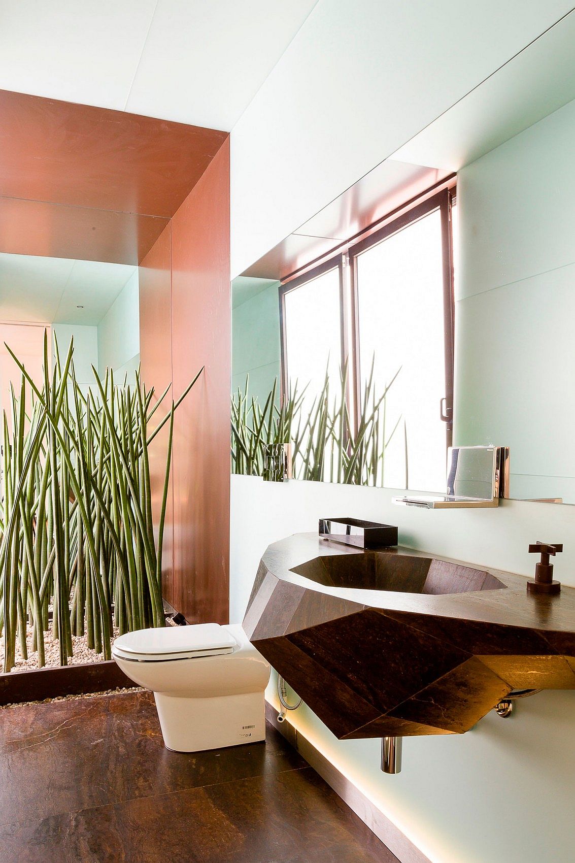 Sculptural sink and custom toilet for the contemporary bathroom inside AA House