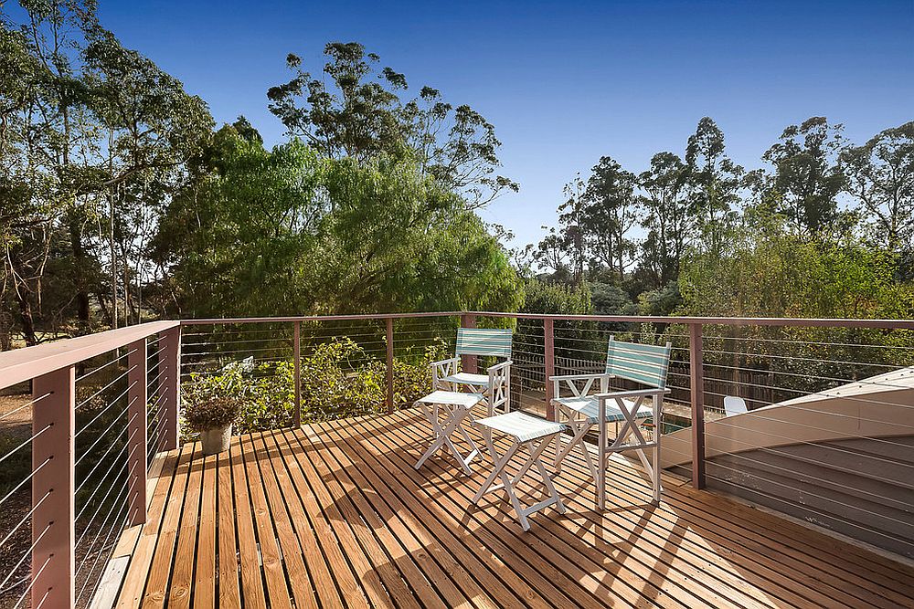 Simple and efficient beach style deck with an unabated view of the green landscape