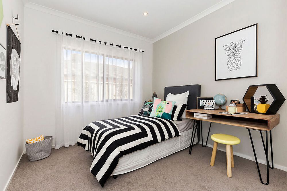 Small bedroom with a cool bedside table and workdesk