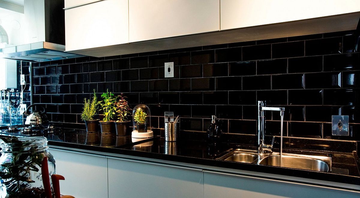 Small kitchen with black granite countertop