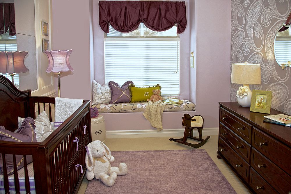 Small nursery seems a lot more spacious thanks to the plush window seat and mirrored wall behind the crib [Design: Rockabye Mommy / Jennifer Termini Photography]