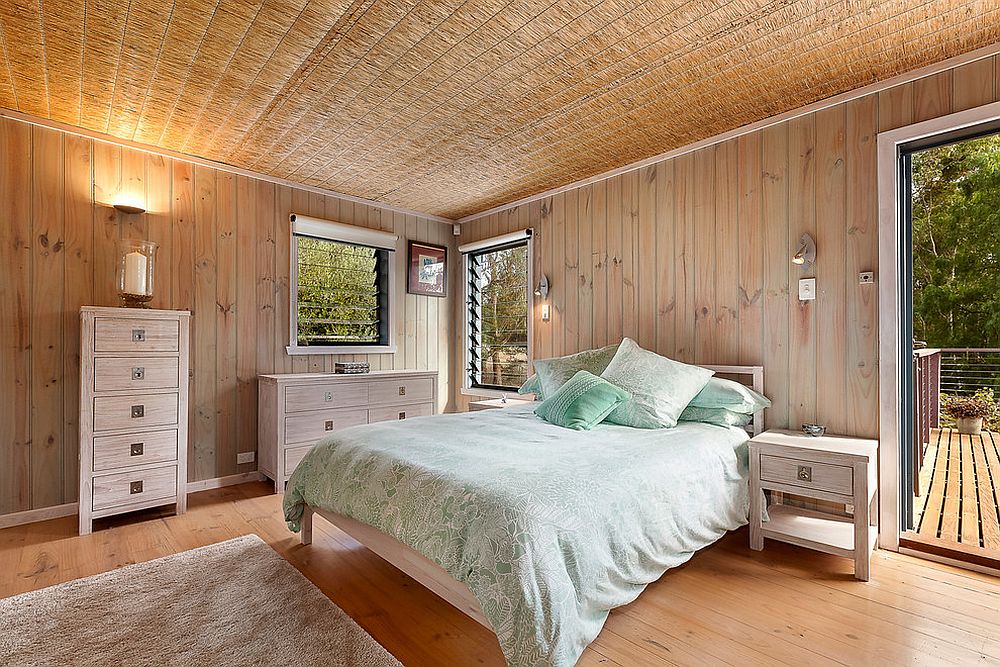 Straw ceiling is the showstopper inside the relaxing beach style bedroom