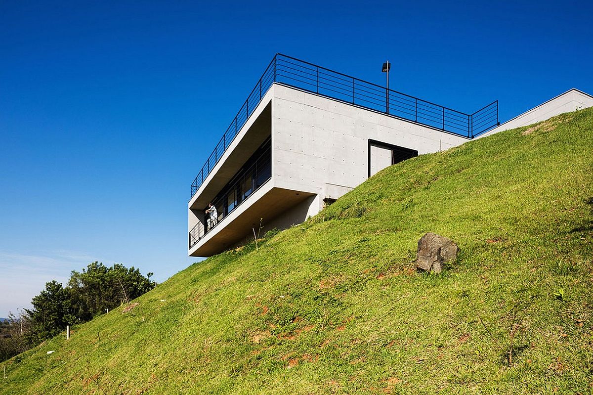 Stylish contemporary home located on a steep, hilly site in Brazil with amazing views