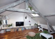 Timber-beams-and-exposed-brick-wall-sections-combined-with-curated-finishes-inside-the-apartment-217x155