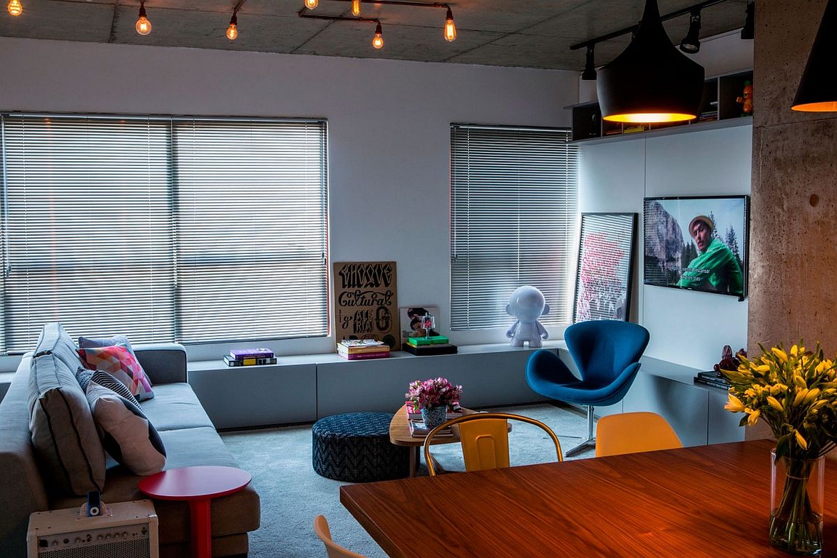 Tom Dixon pendant lights add class to the modest apartment