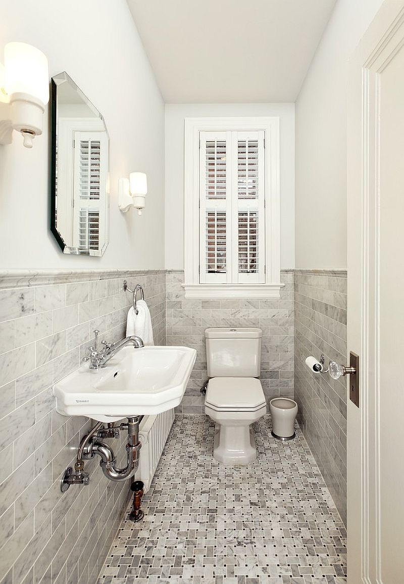 Ultra narrow powder room relies on a monochromatic look for a spacious visual appeal