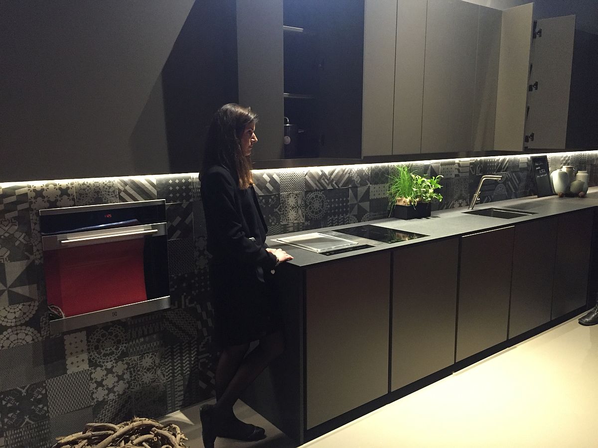 Unique kitchen backsplash with tiles that add pattern without altering the color scheme