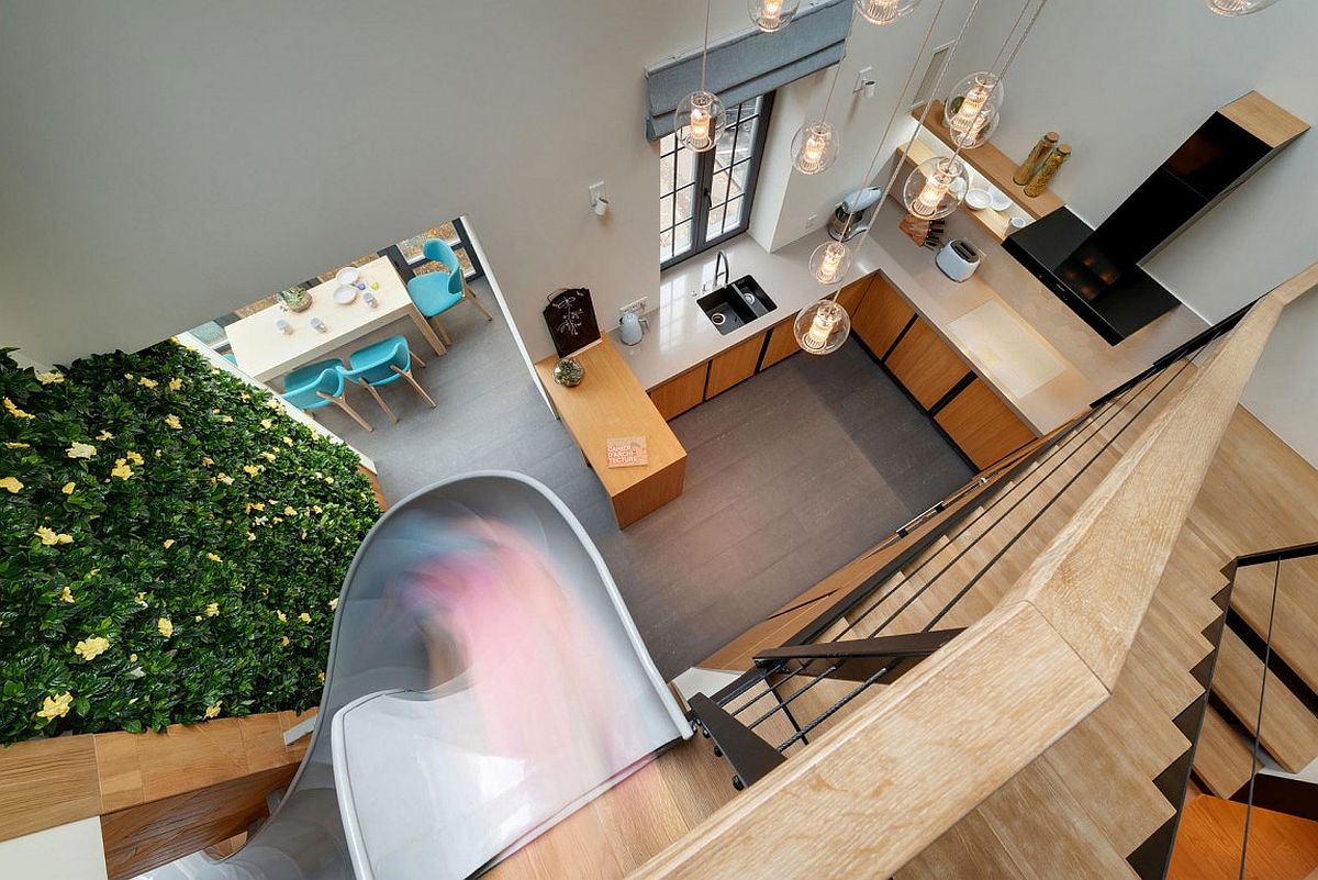 View of lower level kitchen and dining area from the top floor