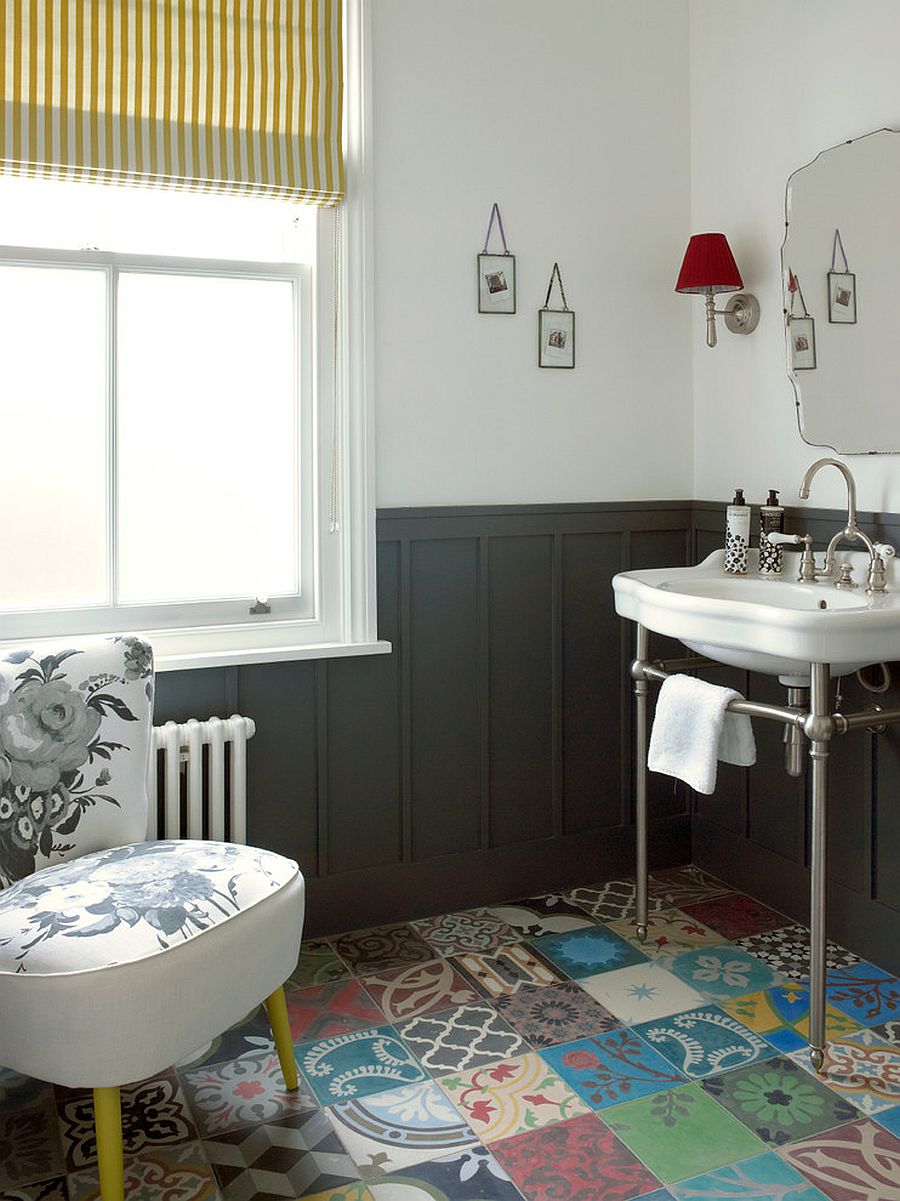 Vivacious patchwork tiled flooring adds color to this classy powder room in London home