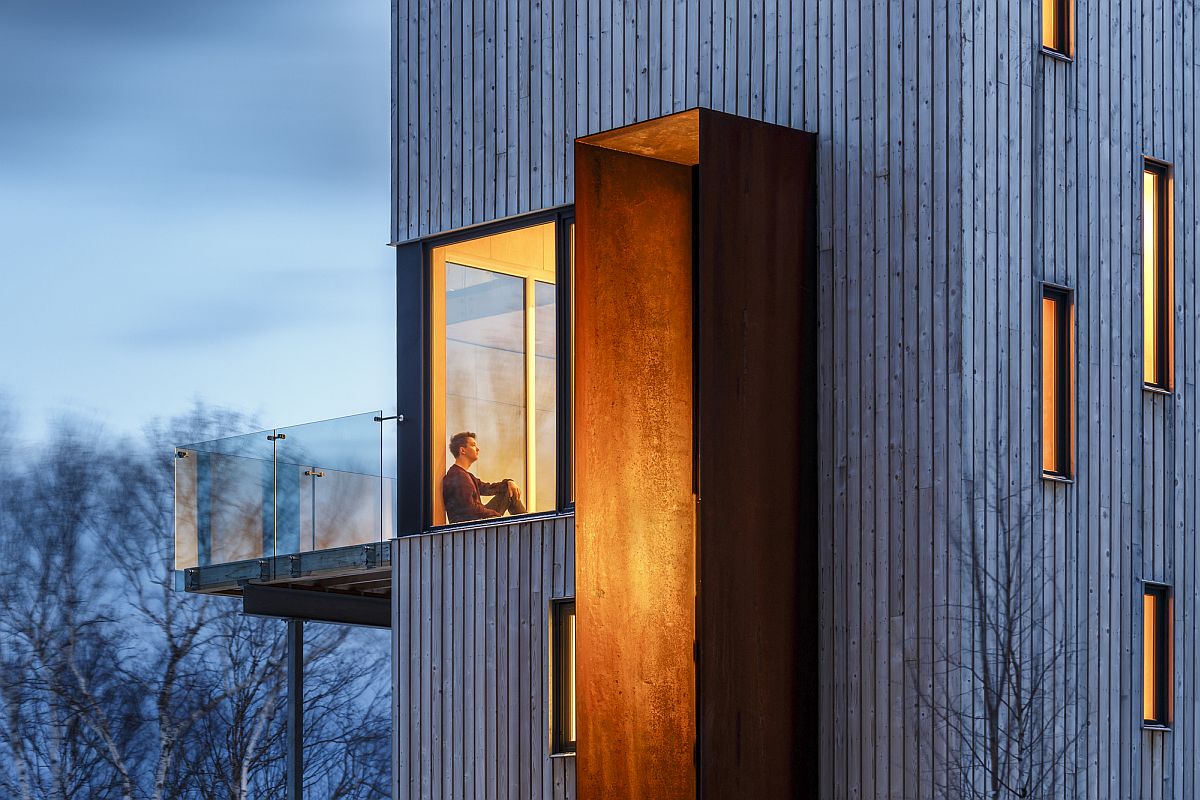 Windbreak crafted from welded weathered steel offers protection to the cabin