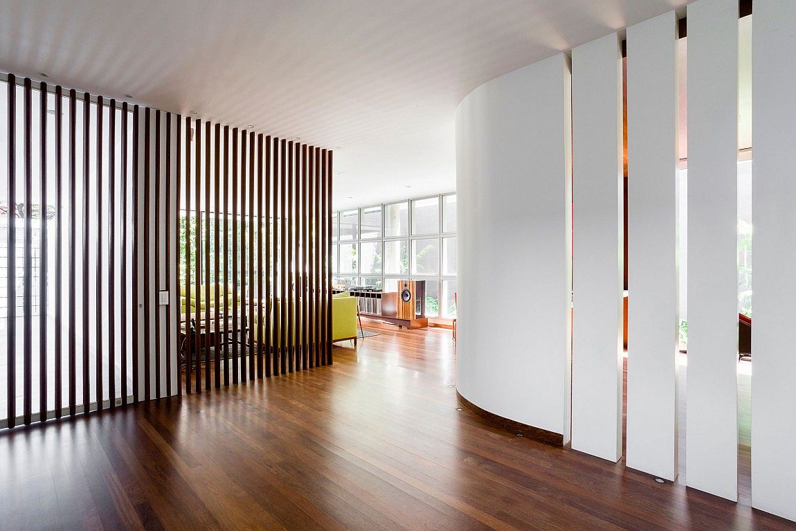 Wooden slats and partitions shape the interior of the home