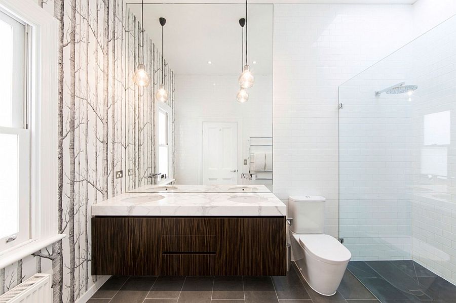 Woodsy wallpaper adds pattern to the bathroom without disturbing the color scheme