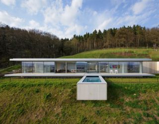 Pool That Seems to Float Above a Hill: Zero-Energy, Minimalist Villa K