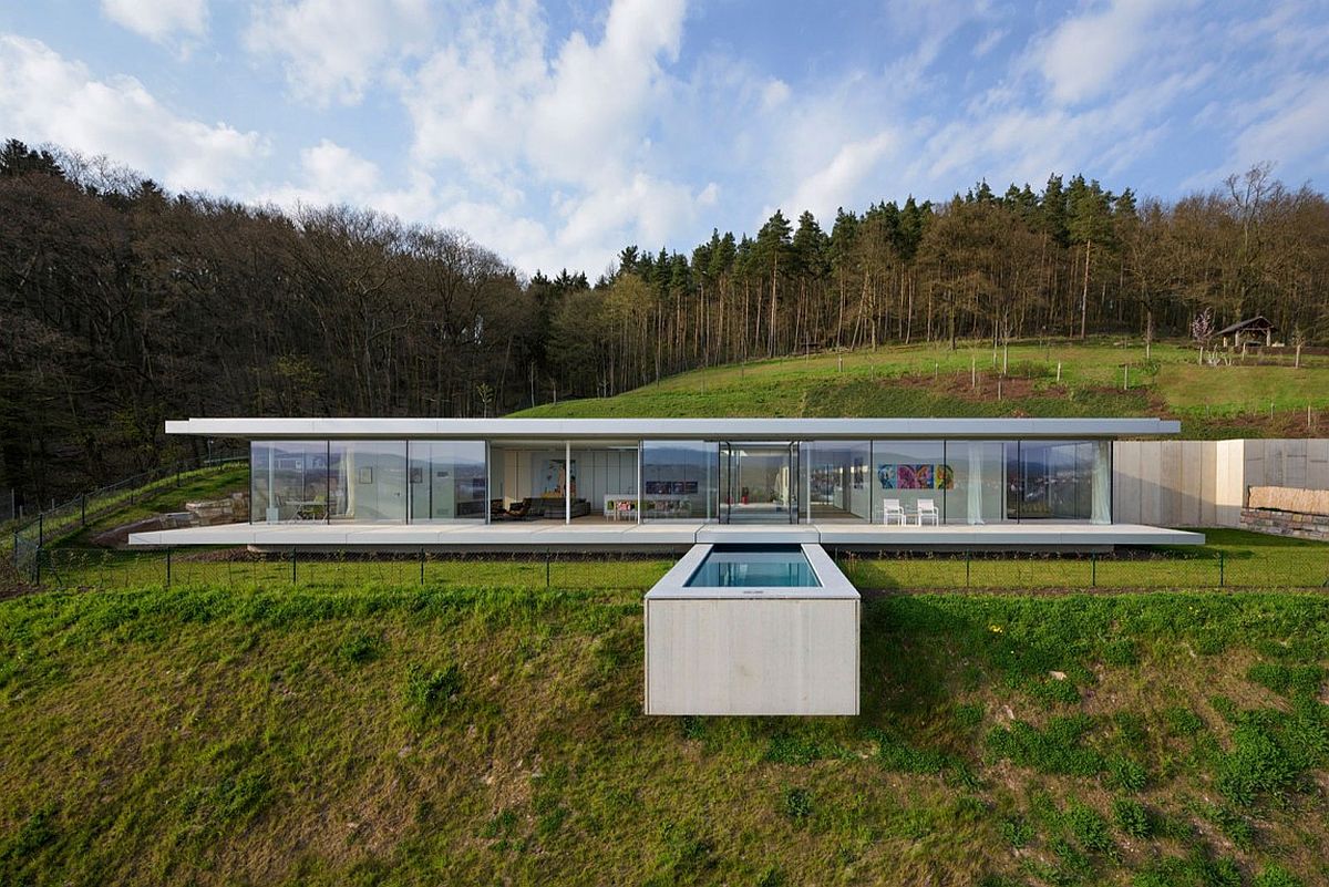 Amazing design of the pool seems to cantilever above the hill slope to create a stunning visual