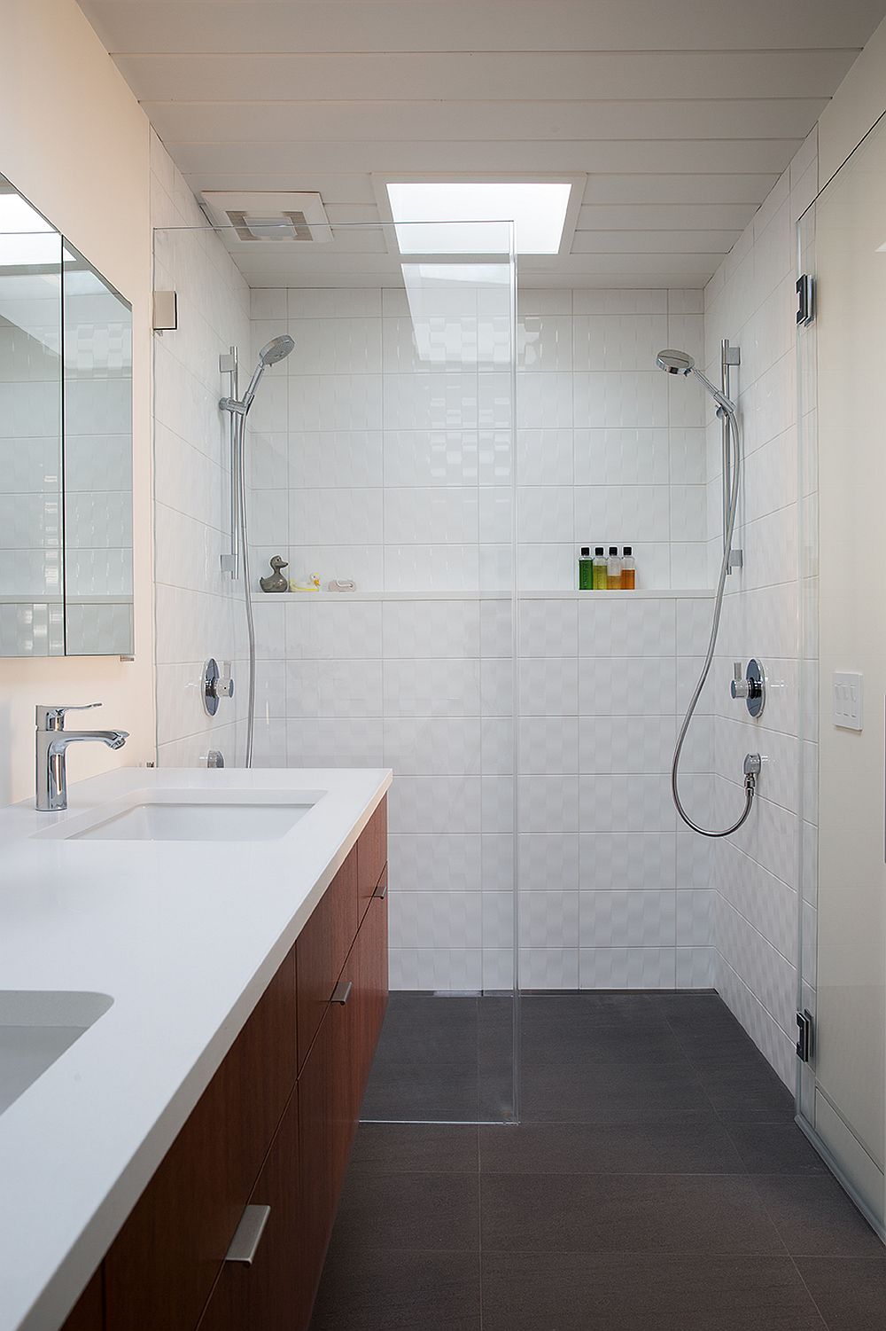 Bathroom in white with floating vanity and skylight