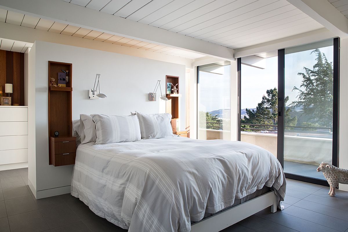 Bedroom of the remodeled Eichler home offers great views