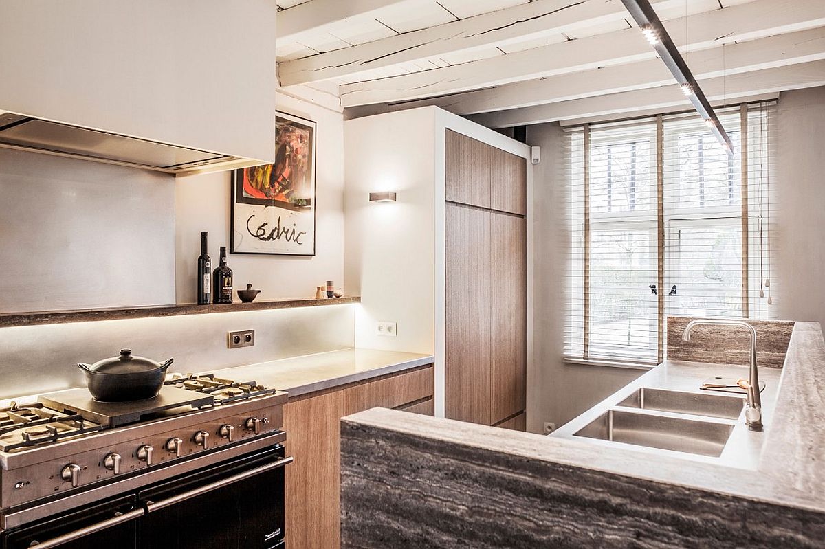 Cabinets with oak veneer fronts add warmth to the farmhouse kitchen