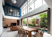 Charming-open-plan-living-in-white-and-blue-with-brick-walls-all-around-217x155