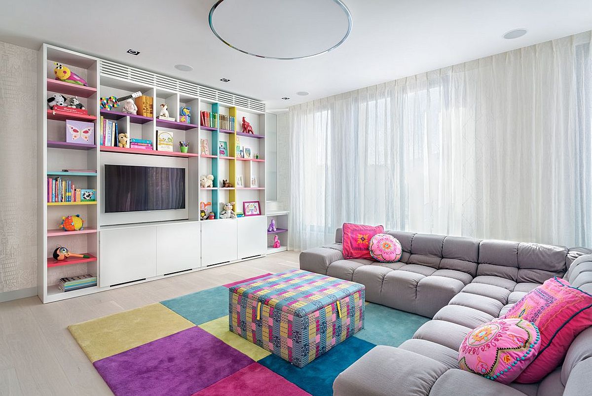 Children's media room and playroom full of color and custom cabinets