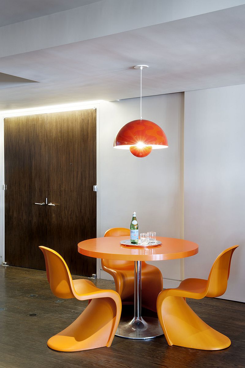 Colorful and snazzy breakfast zone with orange panton chairs